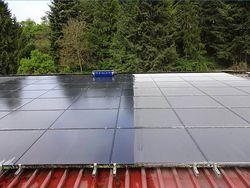 Cleaning a photovoltaic rooftop system